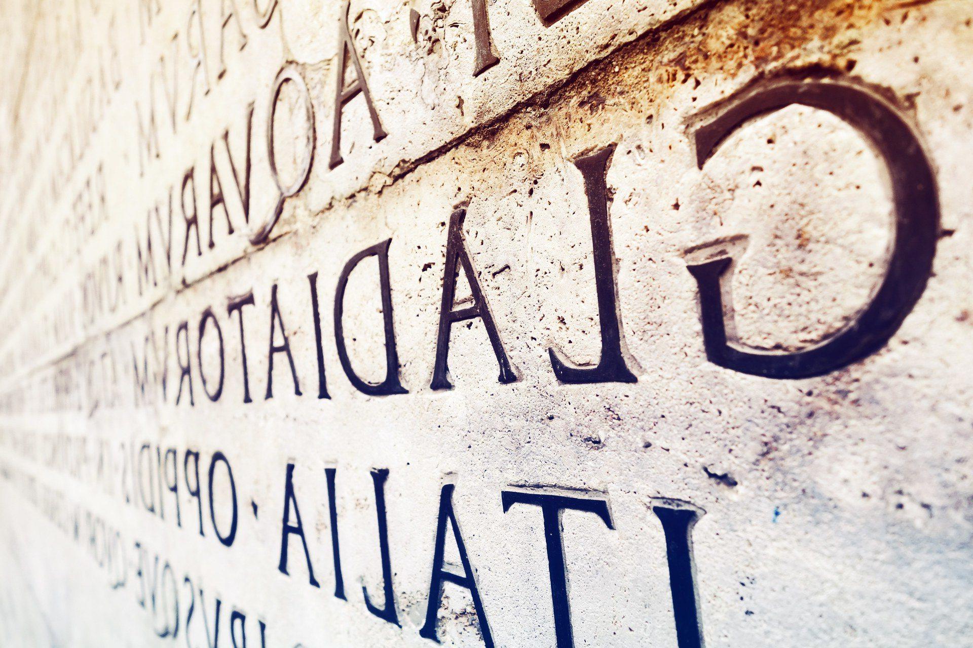 A stone wall engraved with Latin words, the BGSU Latin major or minor opens up doors to the past and present.
