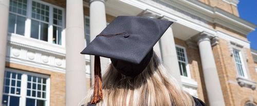 back of student's head wearing graduation cap